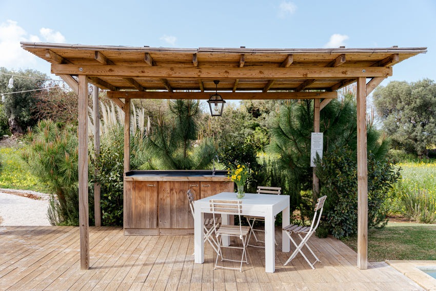 Airstream Petrarolo terrace dining space with pool view and seating