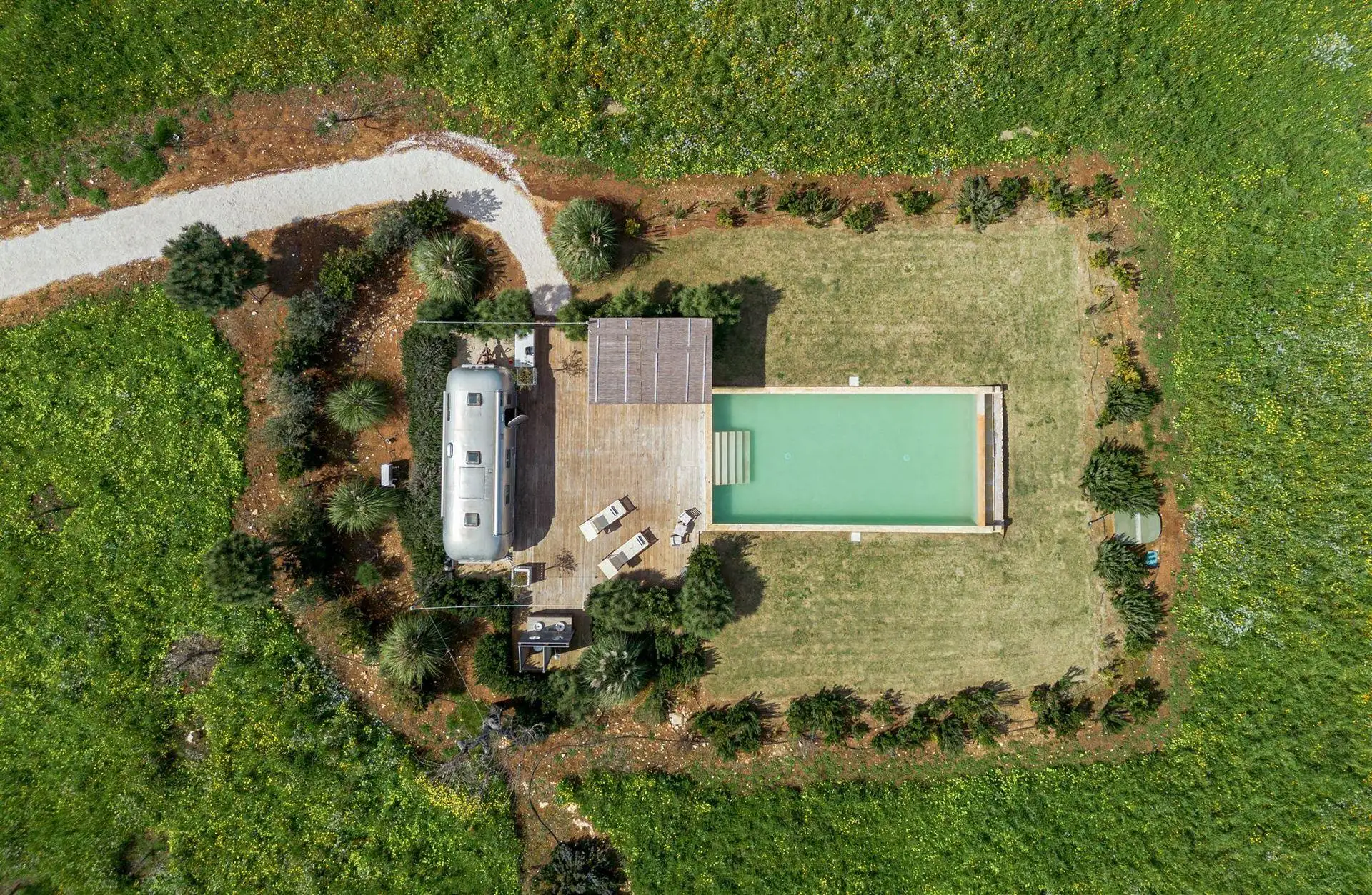 Airstream Petrarolo aerial view with pool, terrace and surrounding countryside in Italy