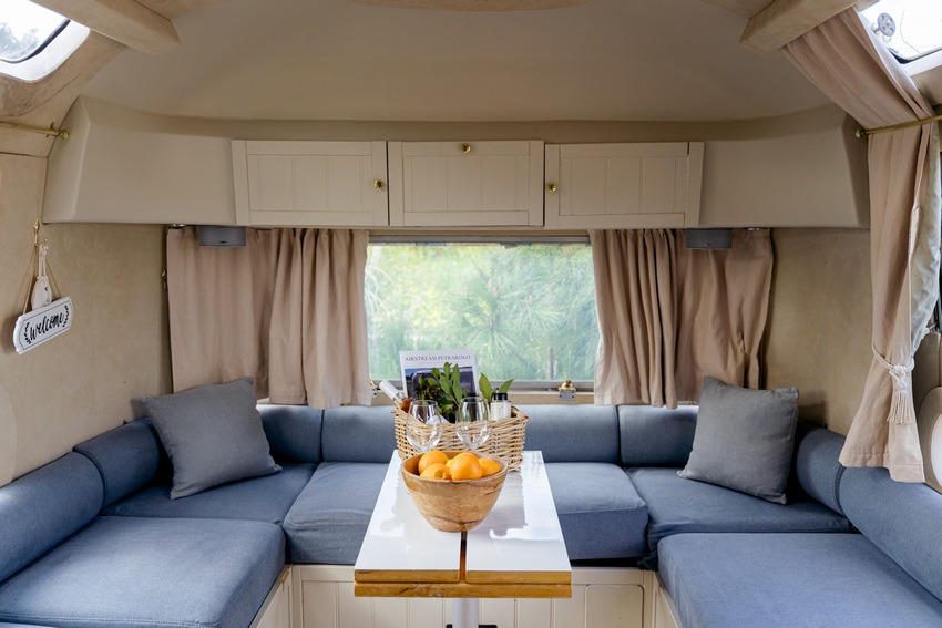 Airstream Petrarolo dining area with compact table and modern interior